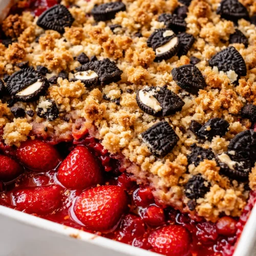 Golden crumble topping with fresh strawberries and whipped cream, the surprise Oreo cookies inside this strawberry shortcake crumble.