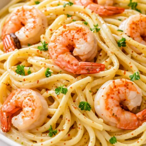 Creamy garlic butter shrimp pasta with plump shrimp in a silky sauce, garnished with parsley and parmesan.